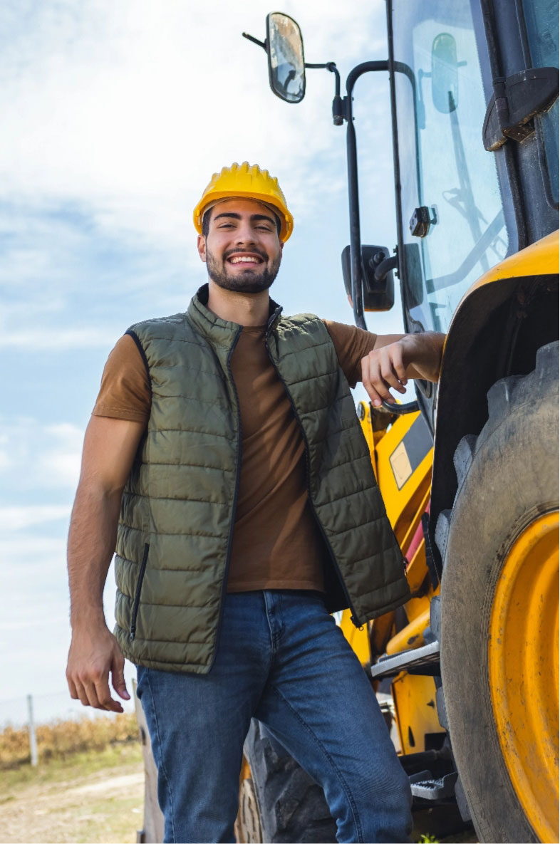 Employee on site besides big tire